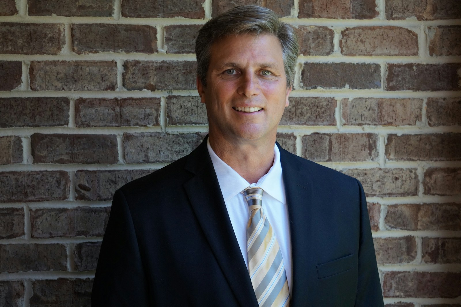 Photo by Shipman Northcutt portrait photography of man wearing black suit jacket
